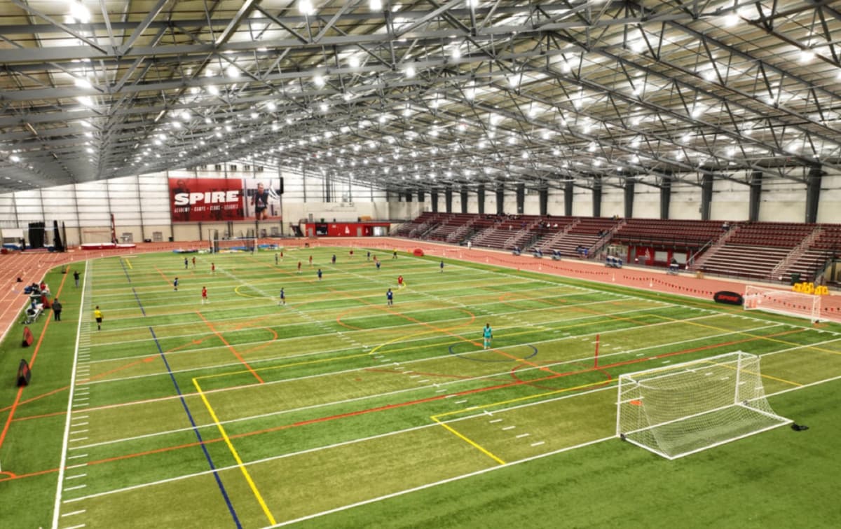 The indoor turf field at Spire under the arena lights