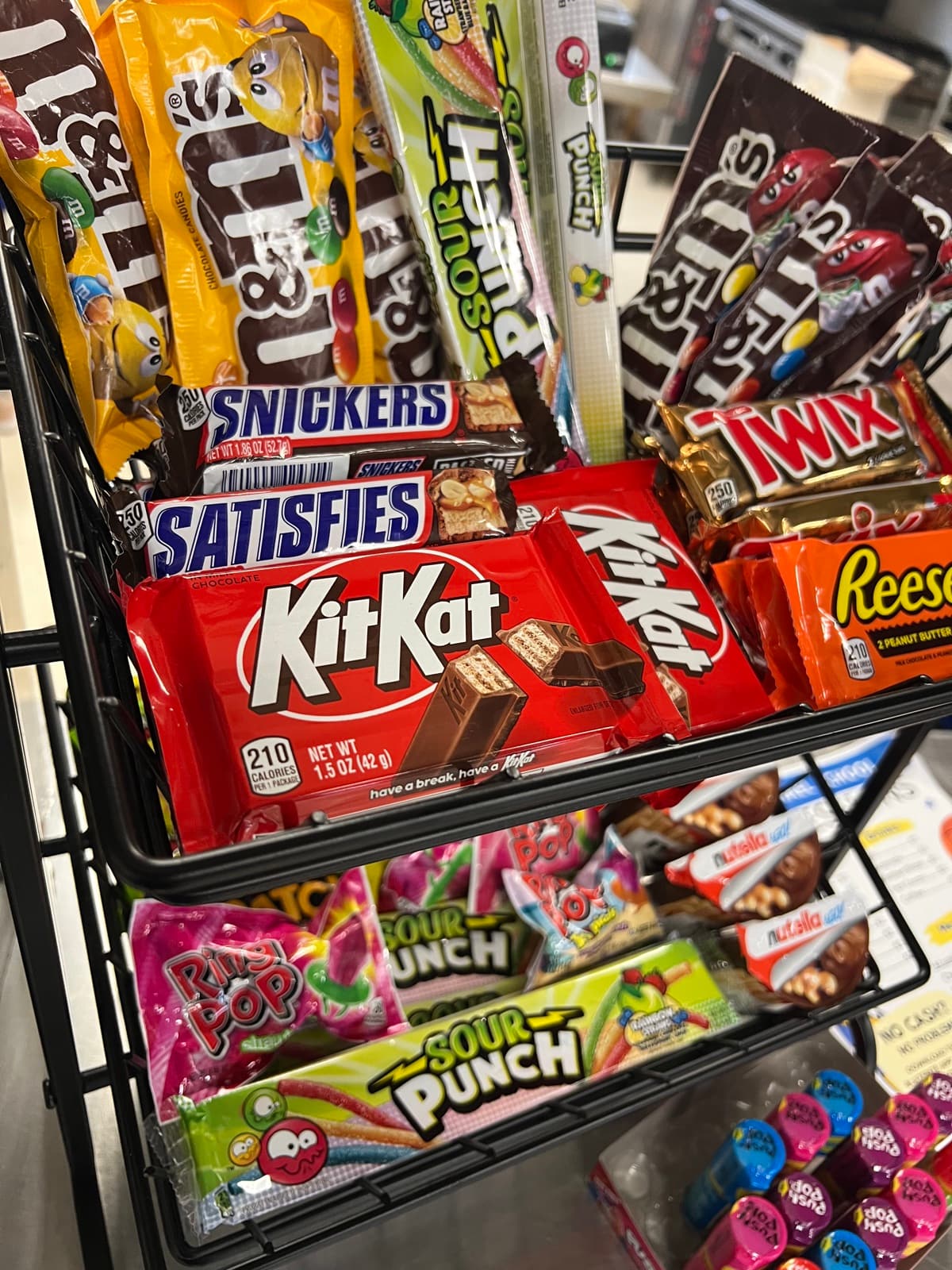 A rack of candy bars at the concession stand
