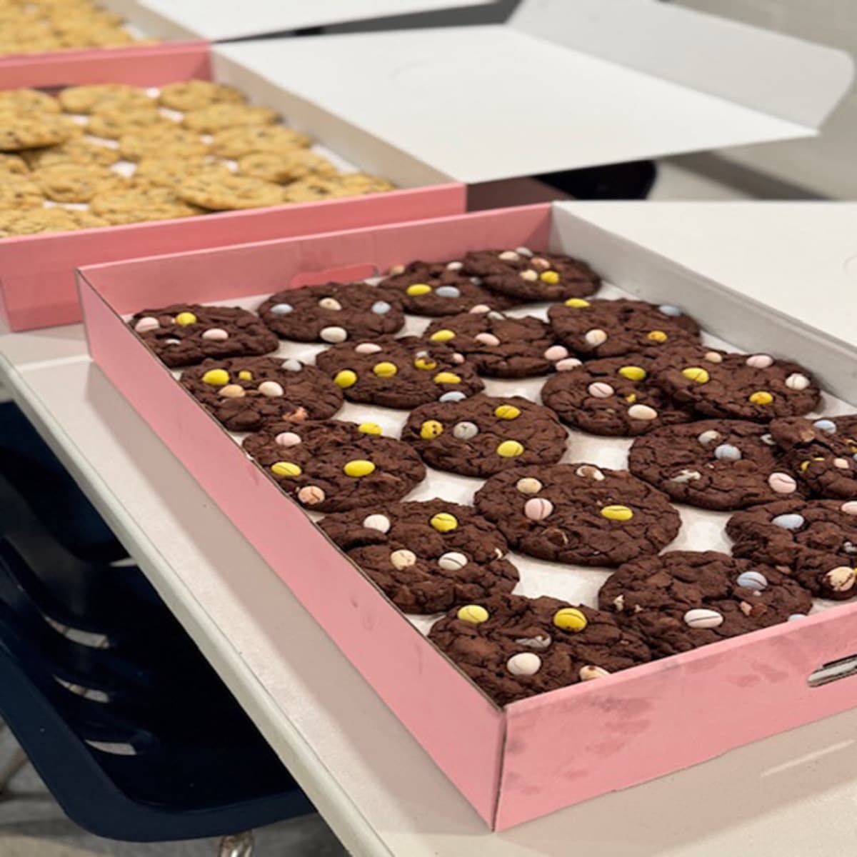 A box of cookies from a fundraiser, ready for pickup