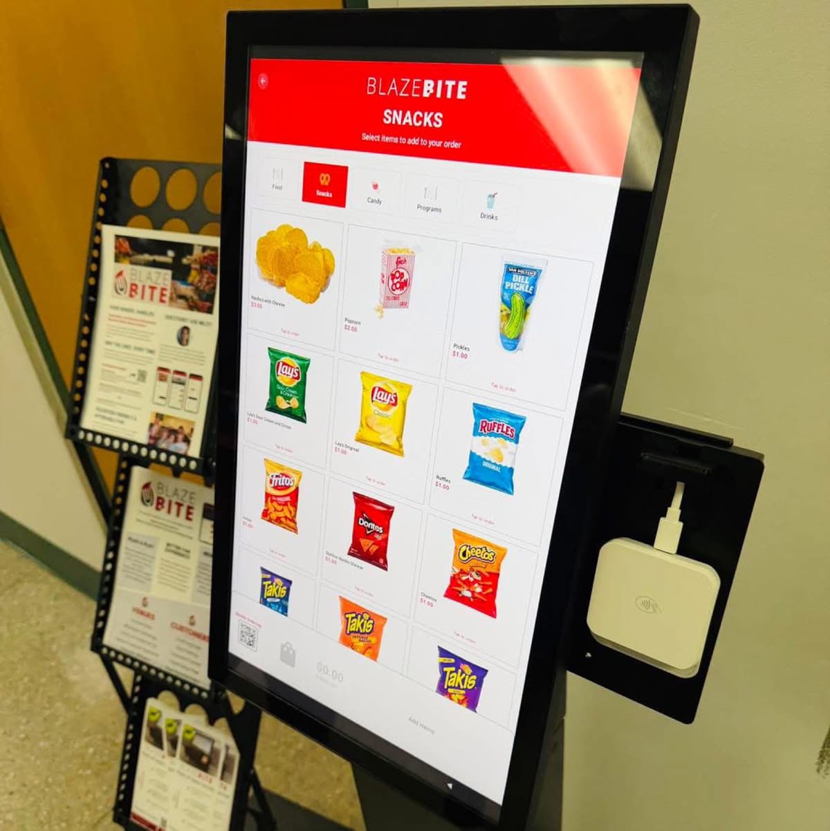The BlazeBite kiosk screen showing the snacks menu with chips and drinks