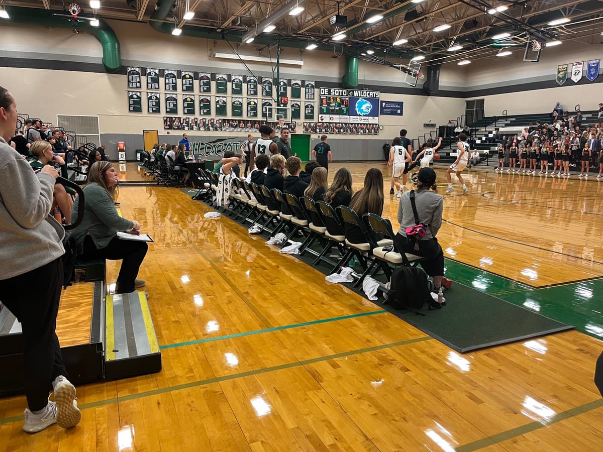 A high school basketball game in a packed gym