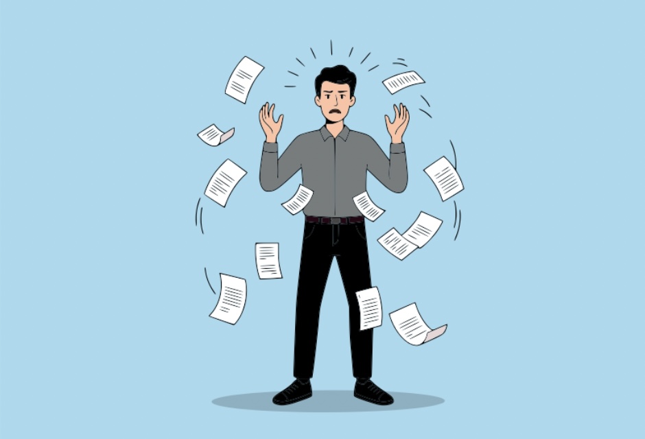 A volunteer overwhelmed by paperwork