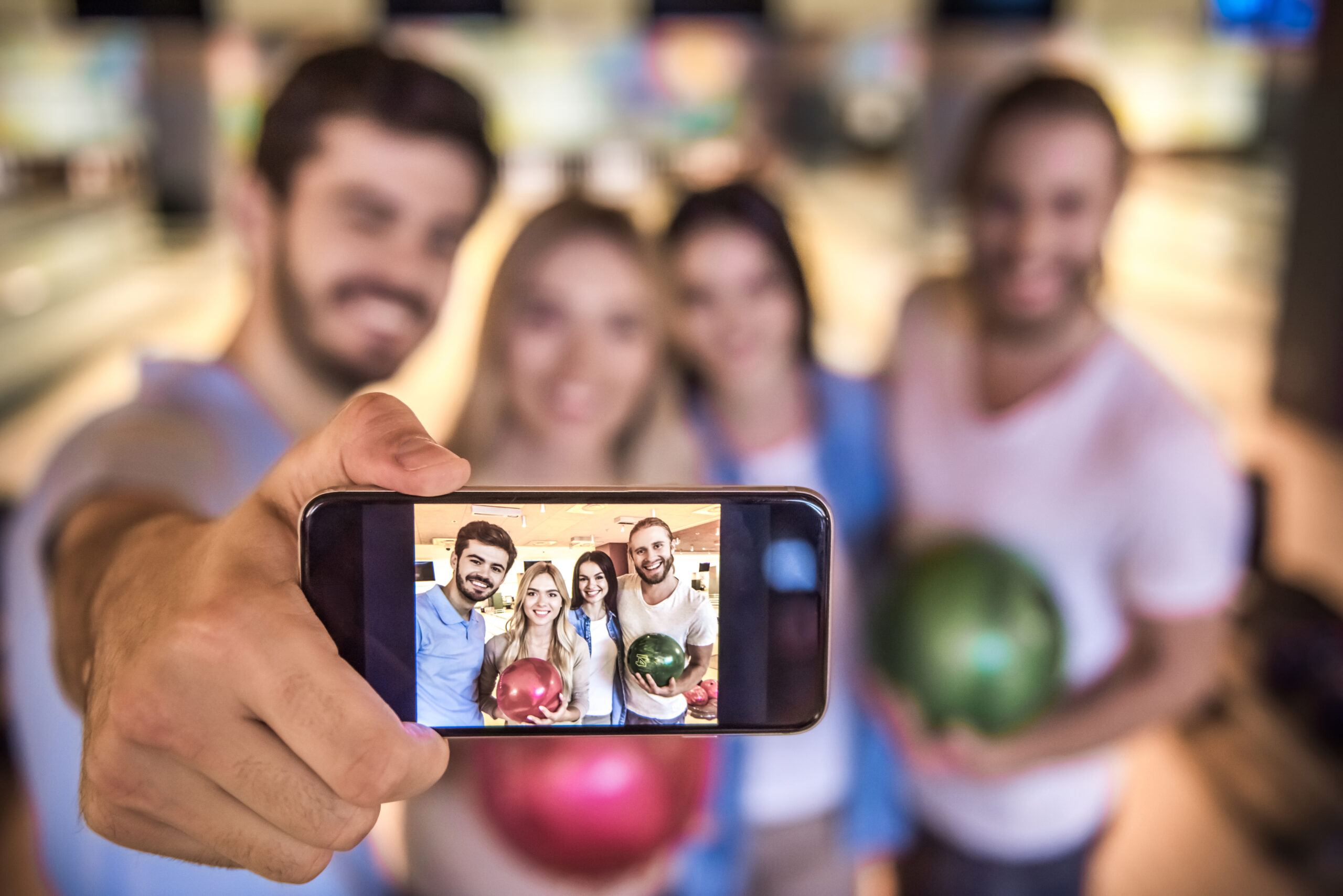 Friends playing bowling